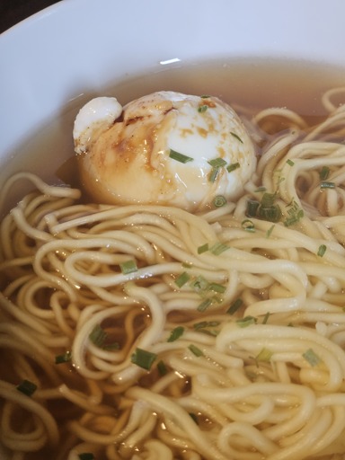 An egg in a bowl of ramen