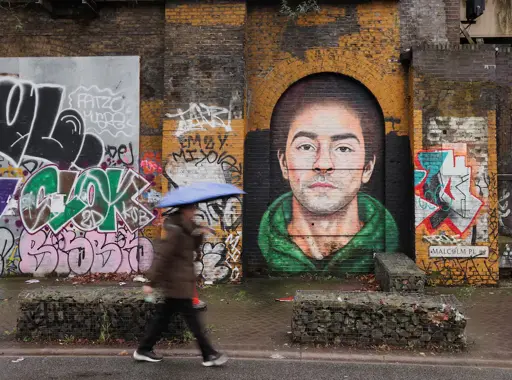 A photo of a mural in London, depicting Luigi Mangione, the accused killer of an American CEO.